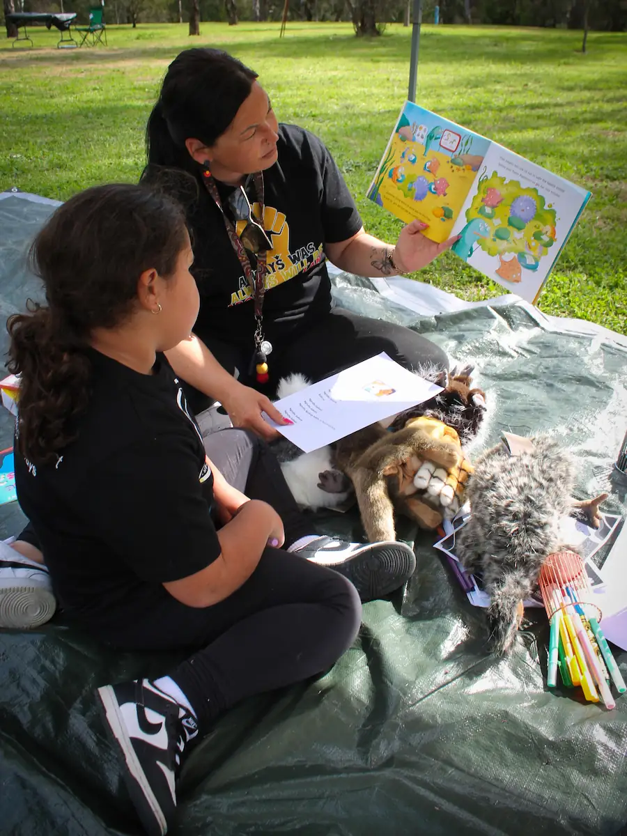 A Dinawan's Connection youth worker mentoring a young person on Country