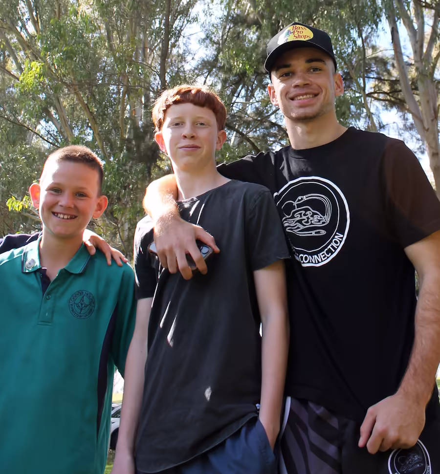 A Dinawan's Connection youth worker mentoring a young person on Country